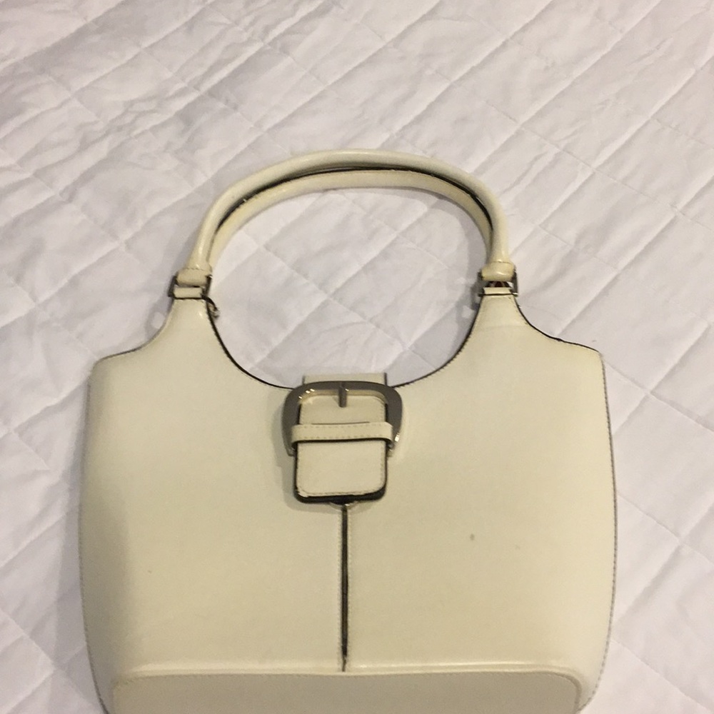 Vintage Off white hand bag with black trim.